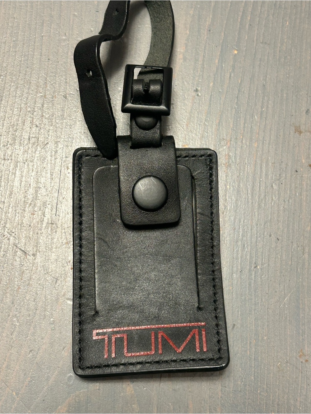 Tumi leather luggage tag